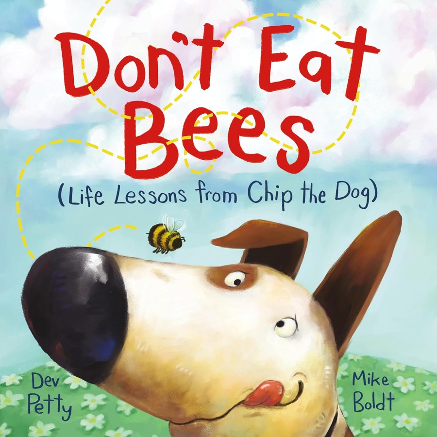 Silly looking brown and white dog with a bee flying around him